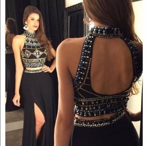 A black prom dress with gold and blue beading